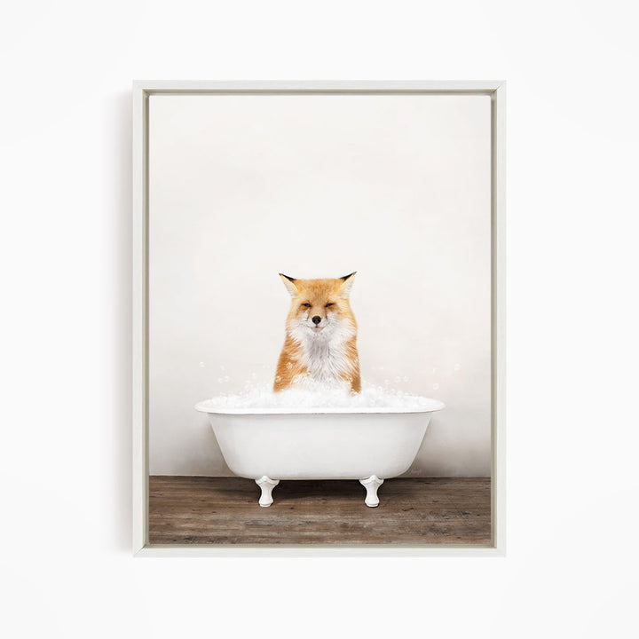 A red fox is sitting in a white bathtub filled with water, looking directly at the camera.