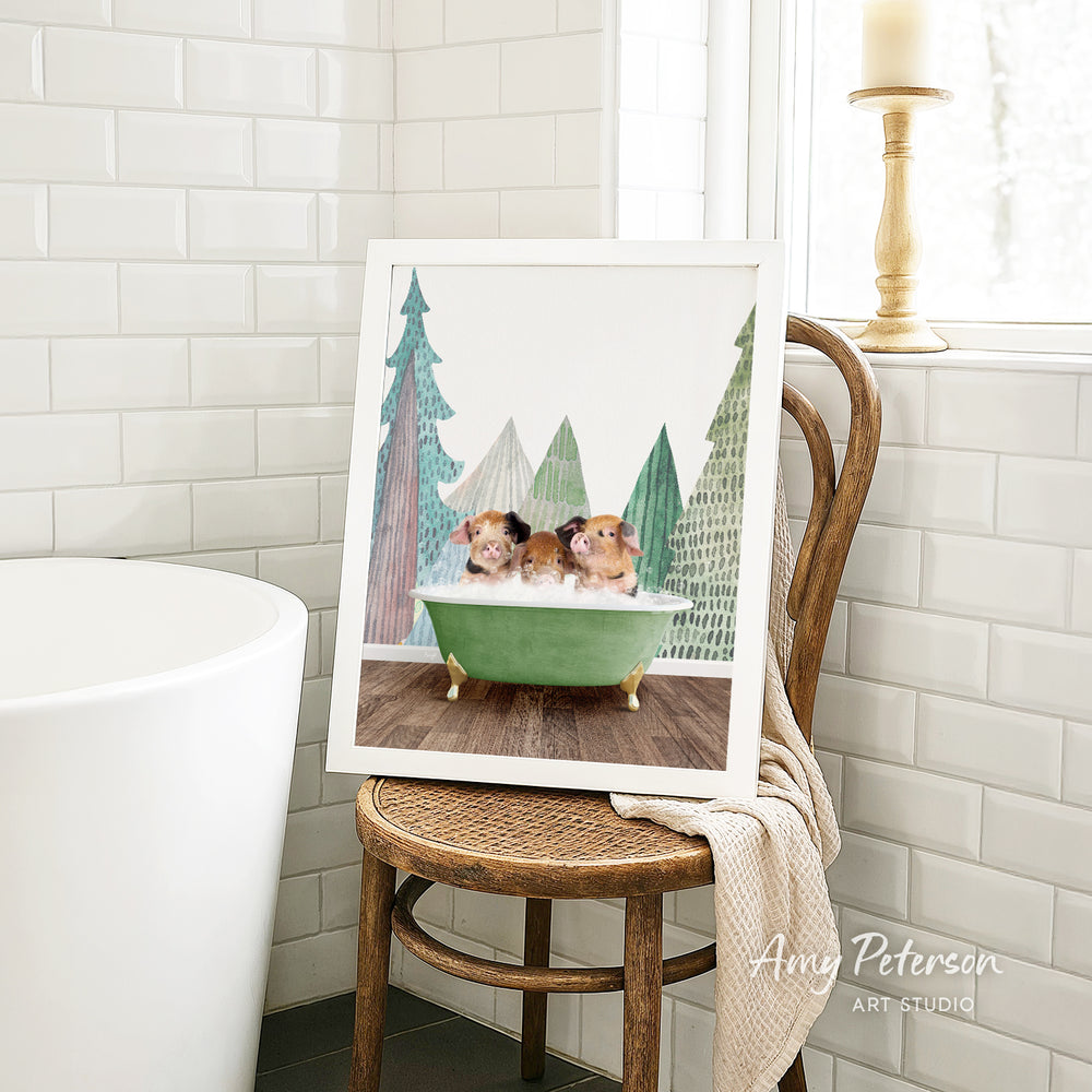 A framed image of two small animals, likely dogs, sitting in a green bathtub, is displayed on a wooden chair in a bathroom setting.
