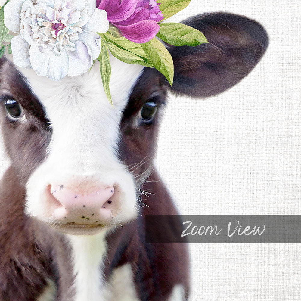 A close-up of a cow's face with a floral headpiece on its head, set against a white background.