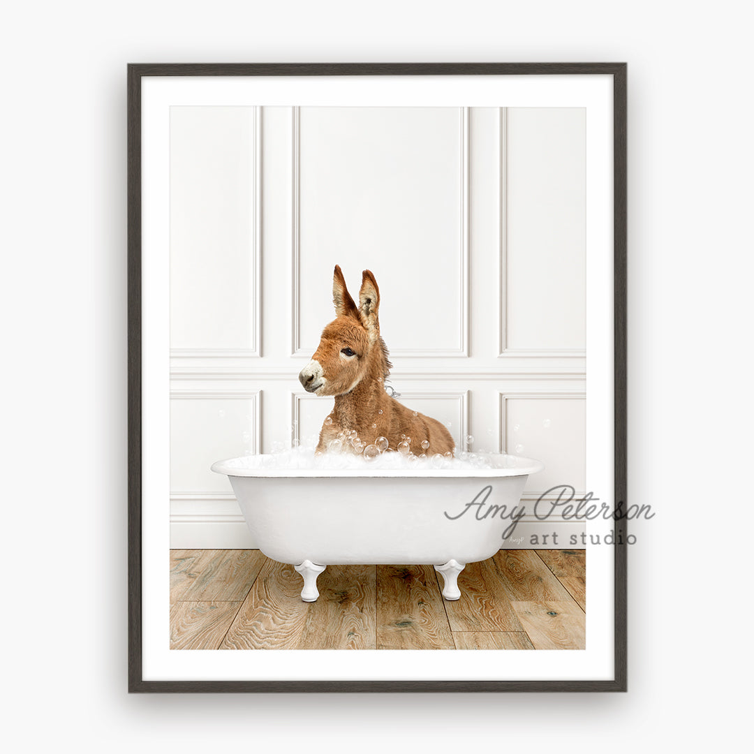 a dog sitting in a bathtub with his head sticking out