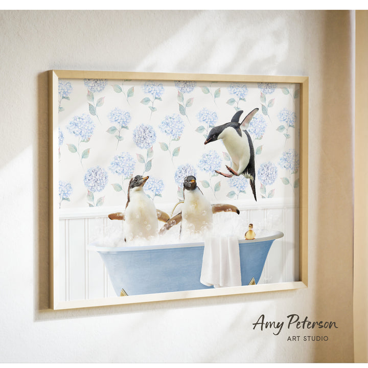 A framed painting depicting three penguins sitting in a bathtub filled with water, surrounded by a floral pattern on the wall.