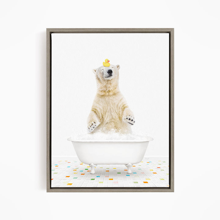 A polar bear is sitting in a white bathtub filled with bubbles, with a rubber duck perched on its head.