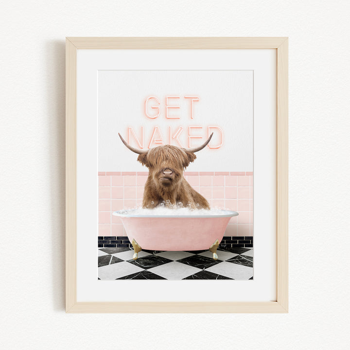 A framed image depicting a Highland cow sitting in a pink bathtub with the text "GET NAKED" displayed above it.