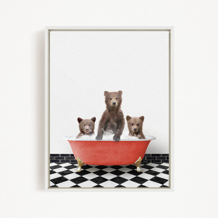 A framed image depicting three brown bears sitting in a red bathtub on a black and white checkered floor.