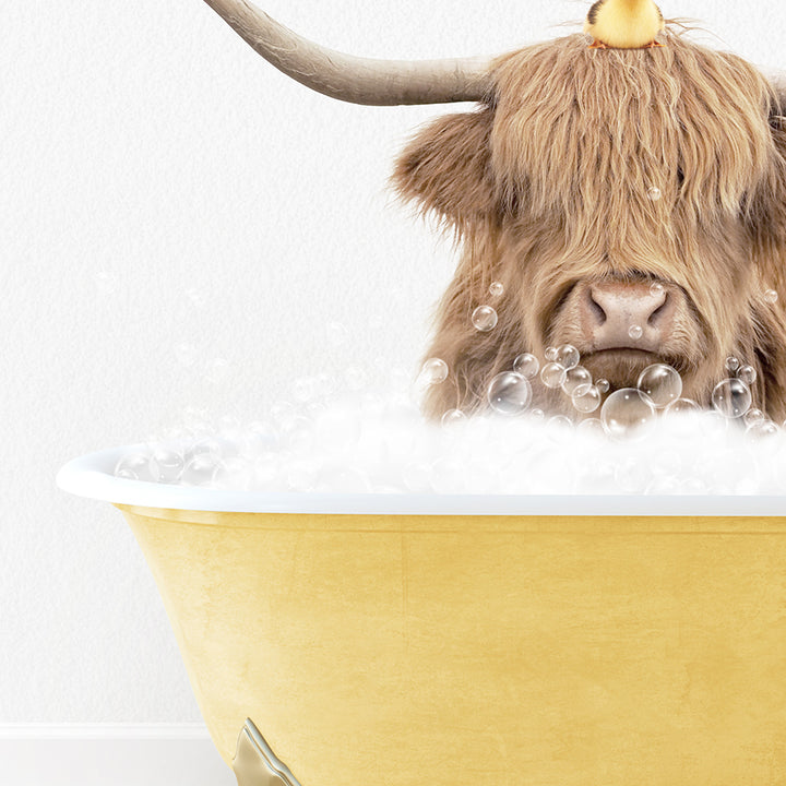 a bull with long horns sitting in a bathtub filled with bubbles