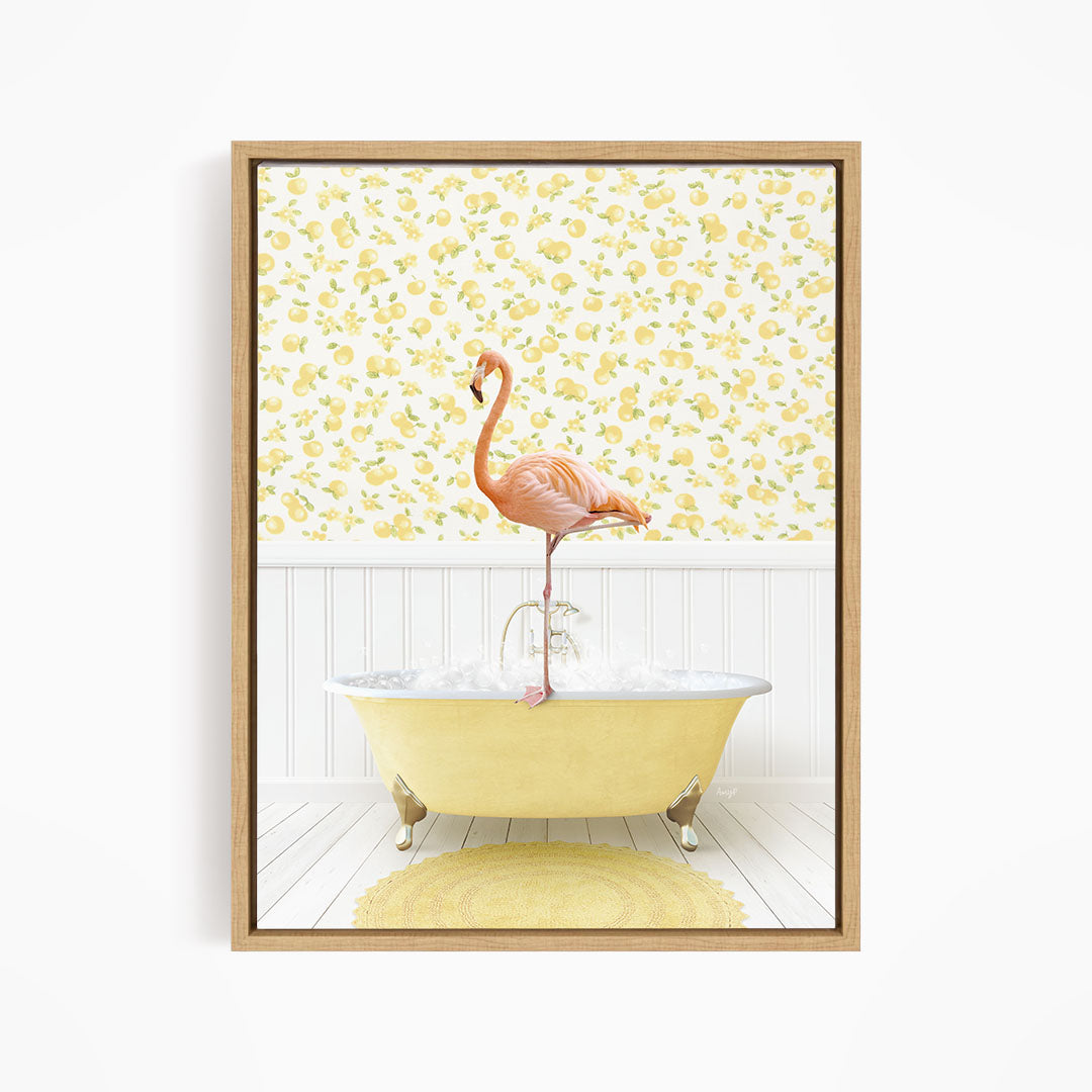 A pink flamingo stands on the edge of a yellow clawfoot bathtub, with a yellow and white floral wallpaper in the background.