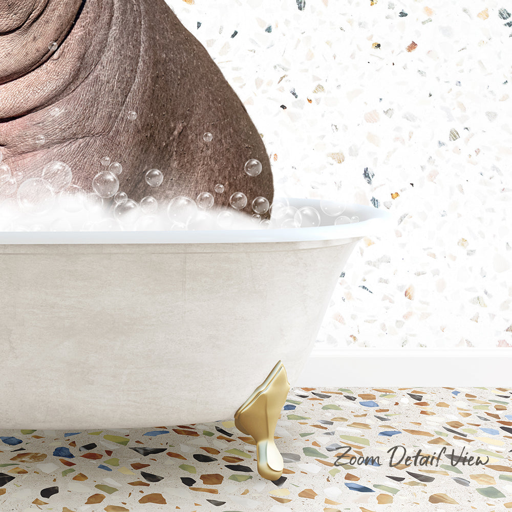 A bathtub filled with bubbles, with a gold-colored bathtub faucet and a mosaic floor in the background.