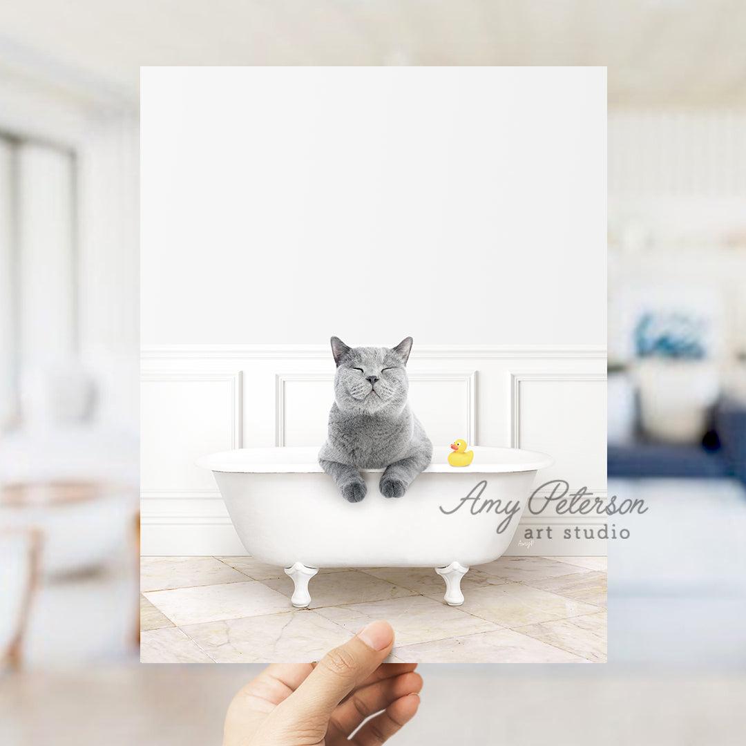 a person holding up a card with a picture of a cat in a bathtub