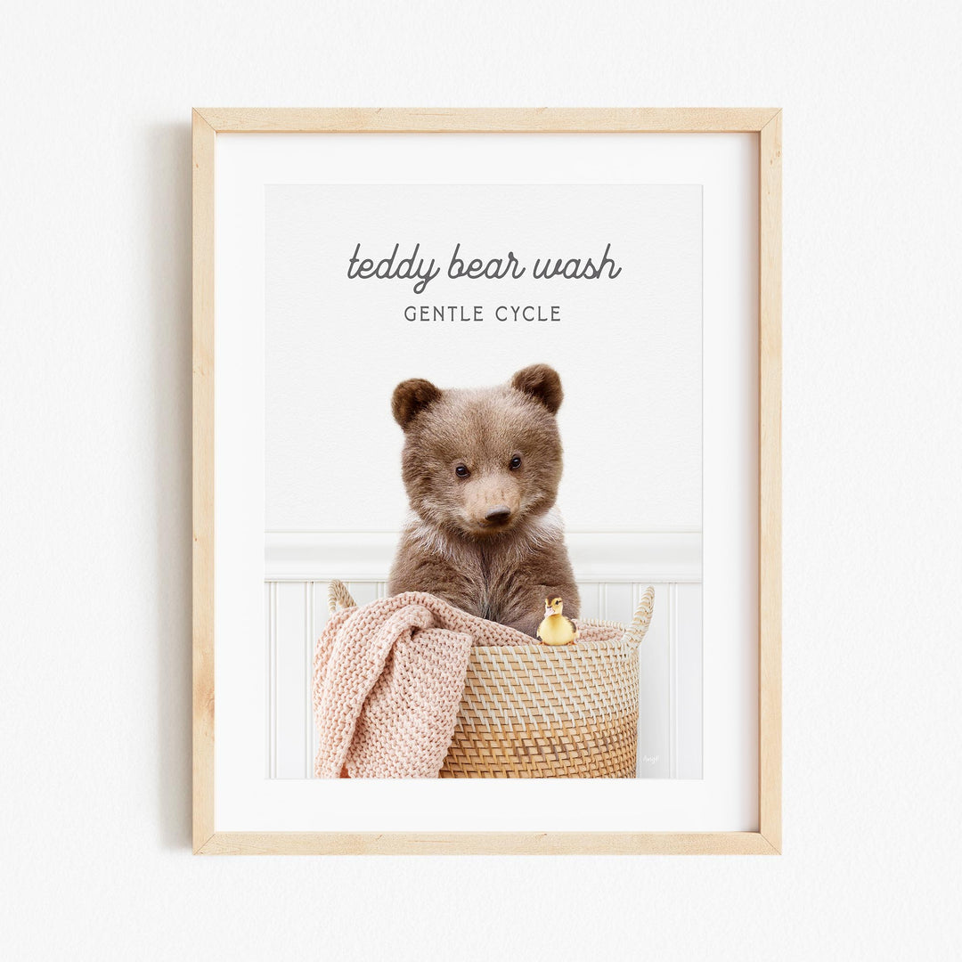a picture of a teddy bear sitting in a basket