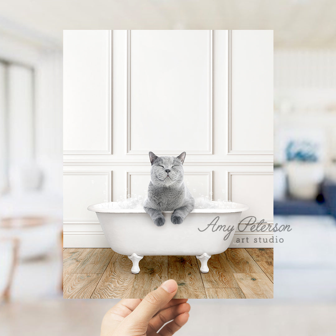 a person holding a photo of a cat in a bathtub