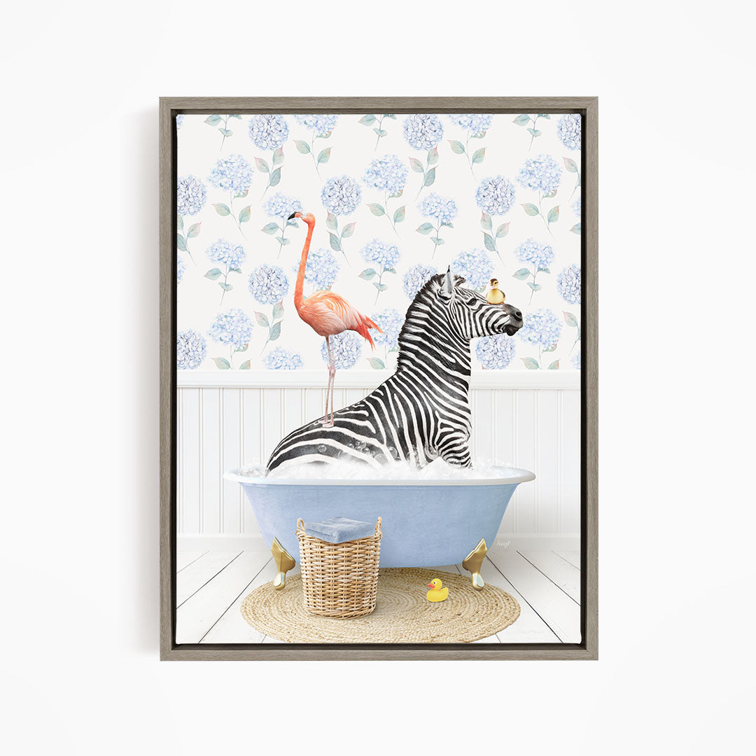 A zebra is sitting in a bathtub, surrounded by a pink flamingo and a basket of rubber ducks, against a backdrop of blue hydrangea flowers.