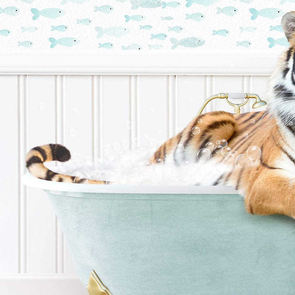 a stuffed tiger is sitting in a bathtub