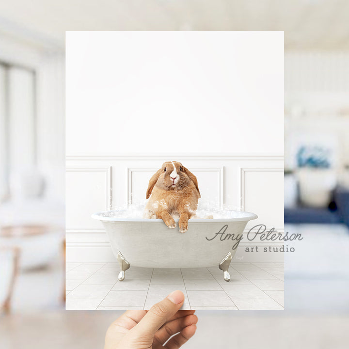 a person holding up a card with a rabbit in a bathtub