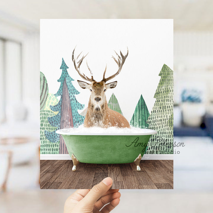 a hand holding up a card with a picture of a deer in a bathtub