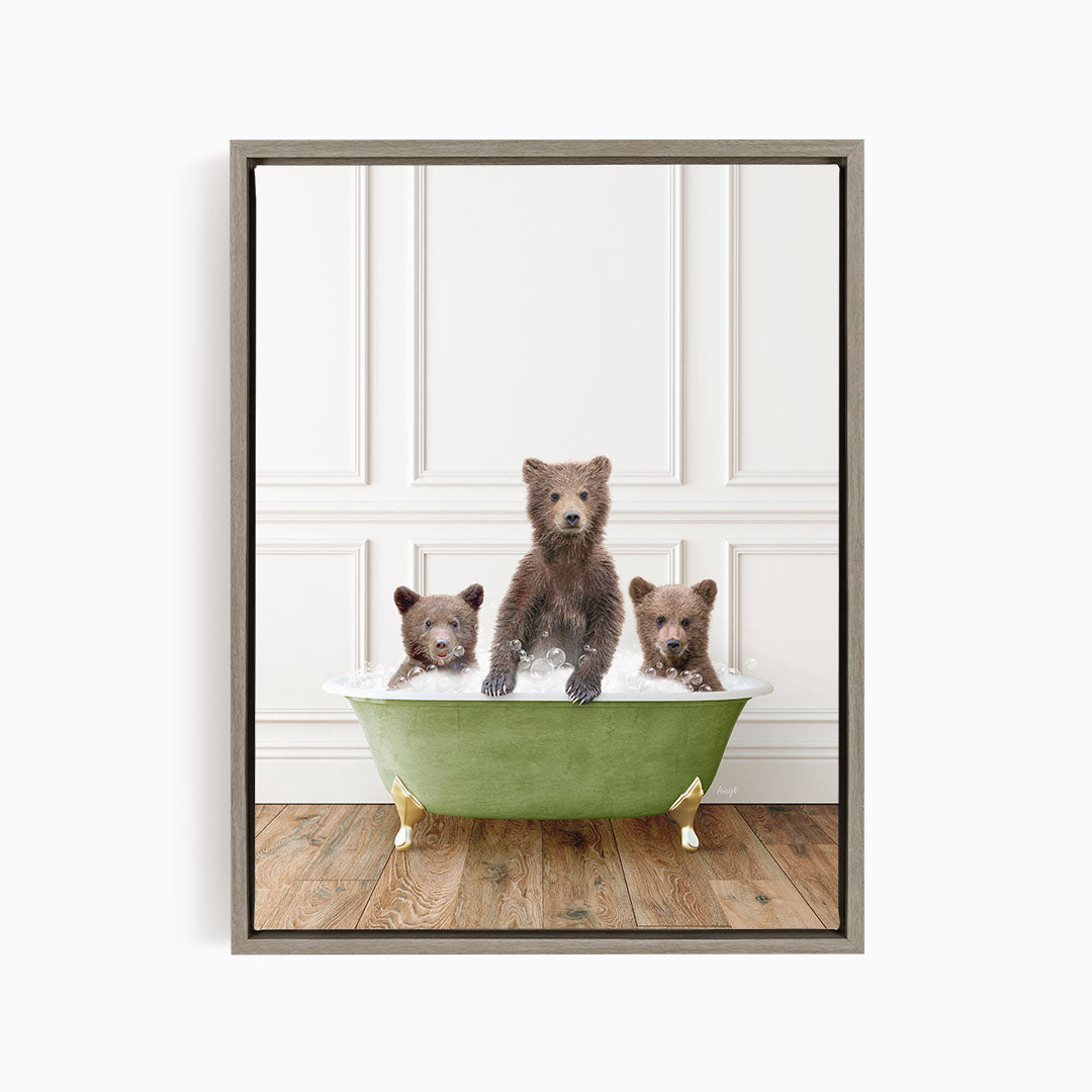 A framed image depicting three bears sitting in a green bathtub, with one bear sitting in the center and the other two bears sitting on either side.