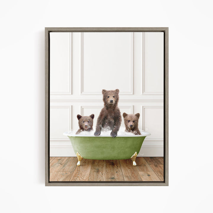 A framed image depicting three bears sitting in a green bathtub, with one bear sitting in the center and the other two bears sitting on either side.