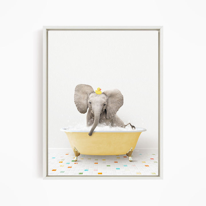 A gray elephant is sitting in a yellow bathtub filled with water, with a rubber duck floating on its head.