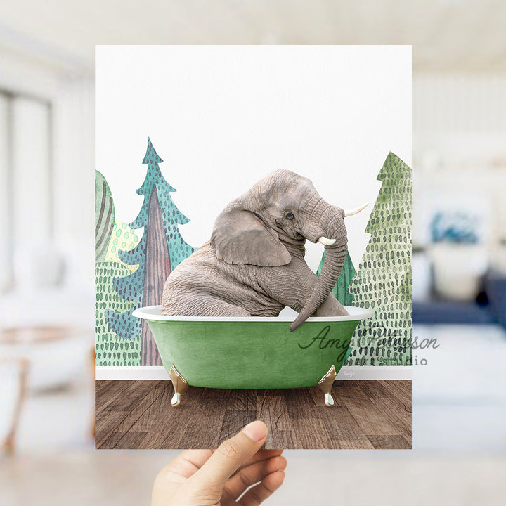 an elephant sitting in a green bath tub