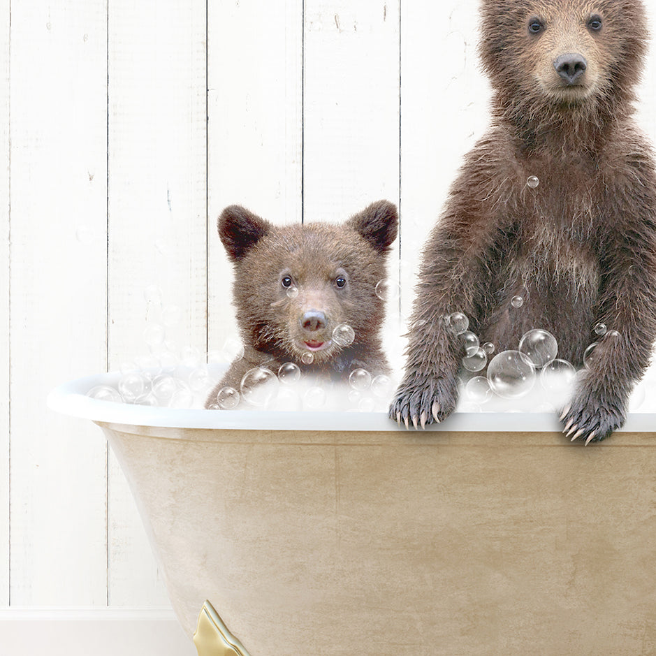 a couple of brown bears sitting inside of a bath tub