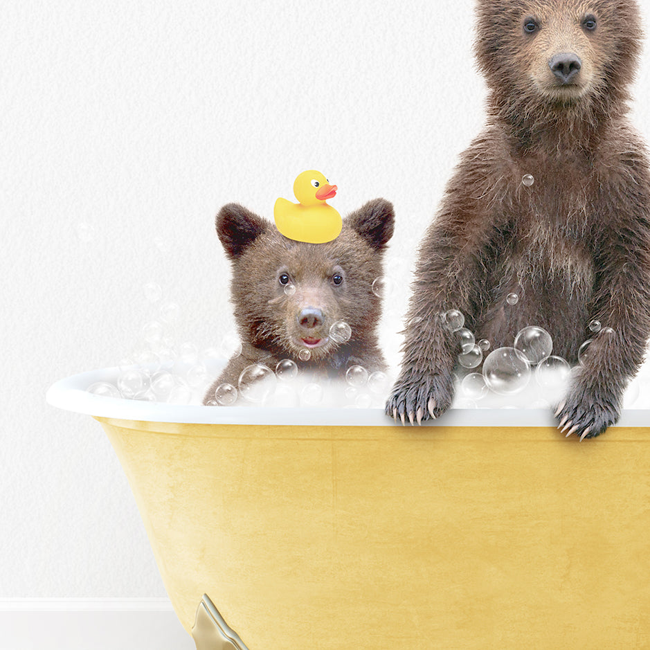 two brown bears in a bathtub with rubber ducky hats