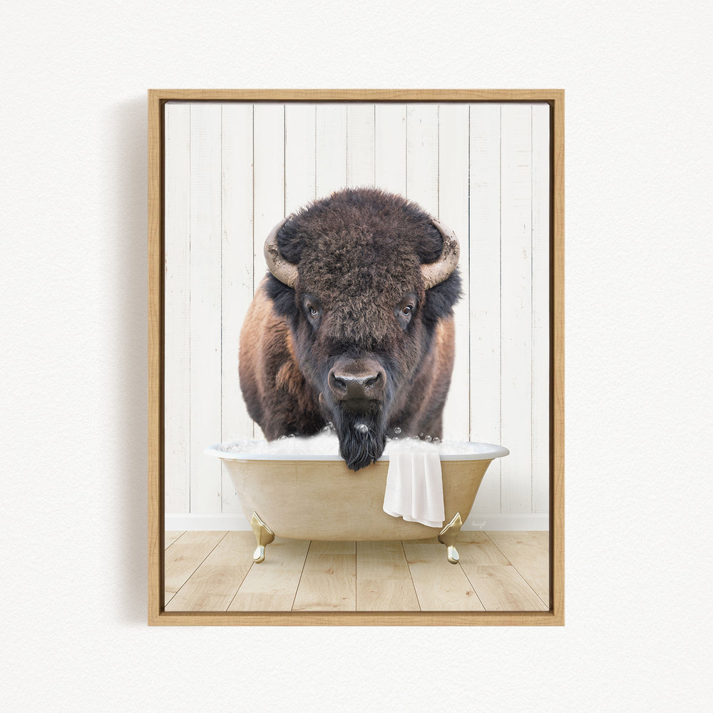 A buffalo with a long beard is sitting in a bathtub, with a towel draped over the side of the tub.