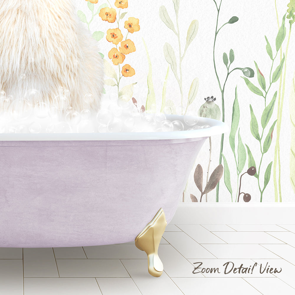 A fluffy white cat sitting in a pink bathtub filled with bubbles, with a floral wallpaper in the background.