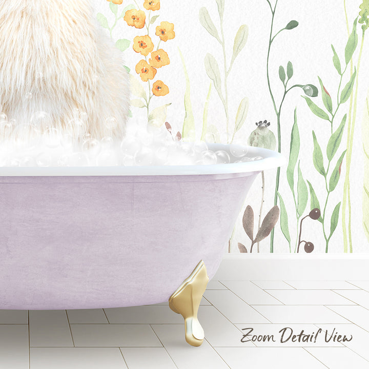 A fluffy white cat sitting in a pink bathtub filled with bubbles, with a floral wallpaper in the background.