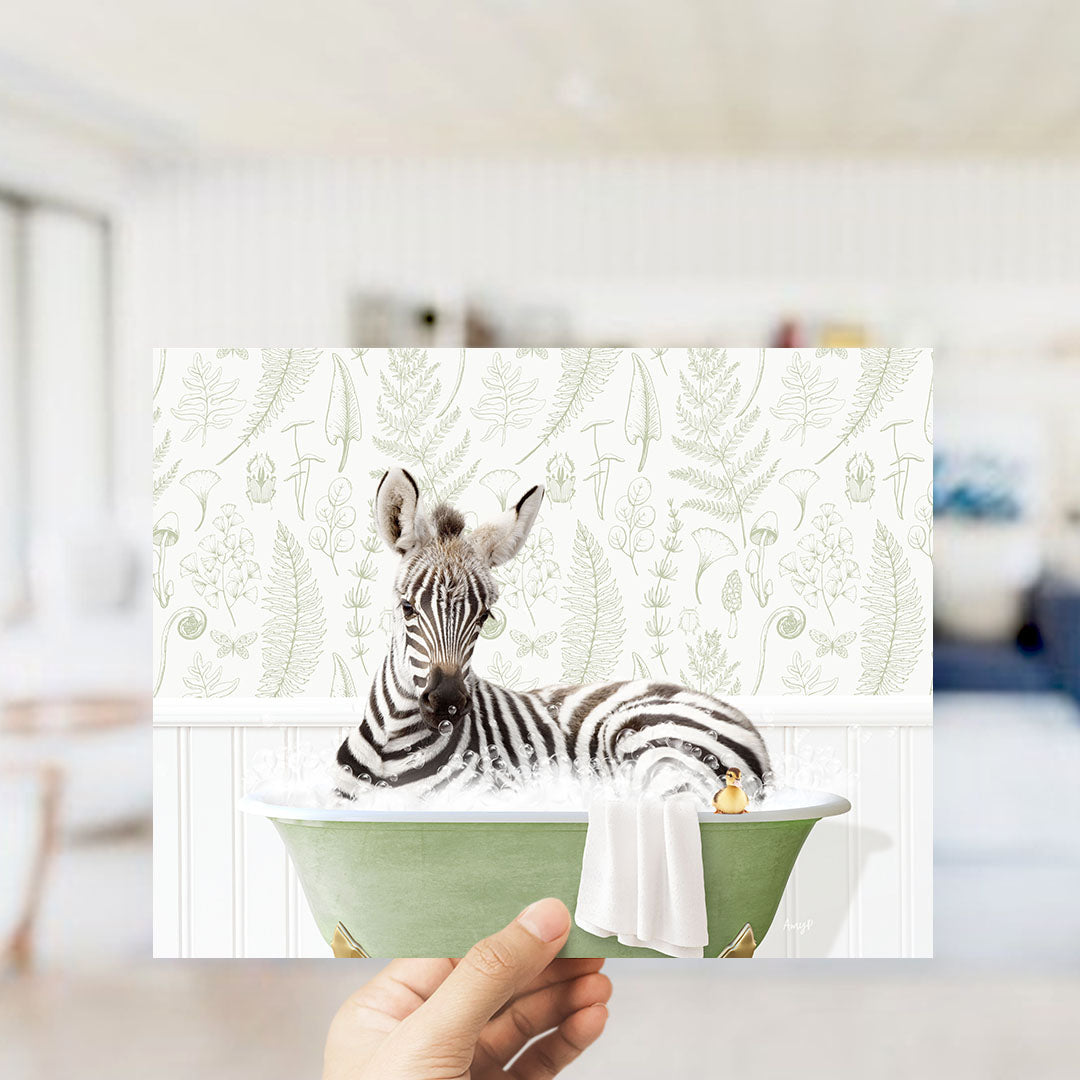 A zebra lying in a green bathtub with a towel, surrounded by a patterned wall.