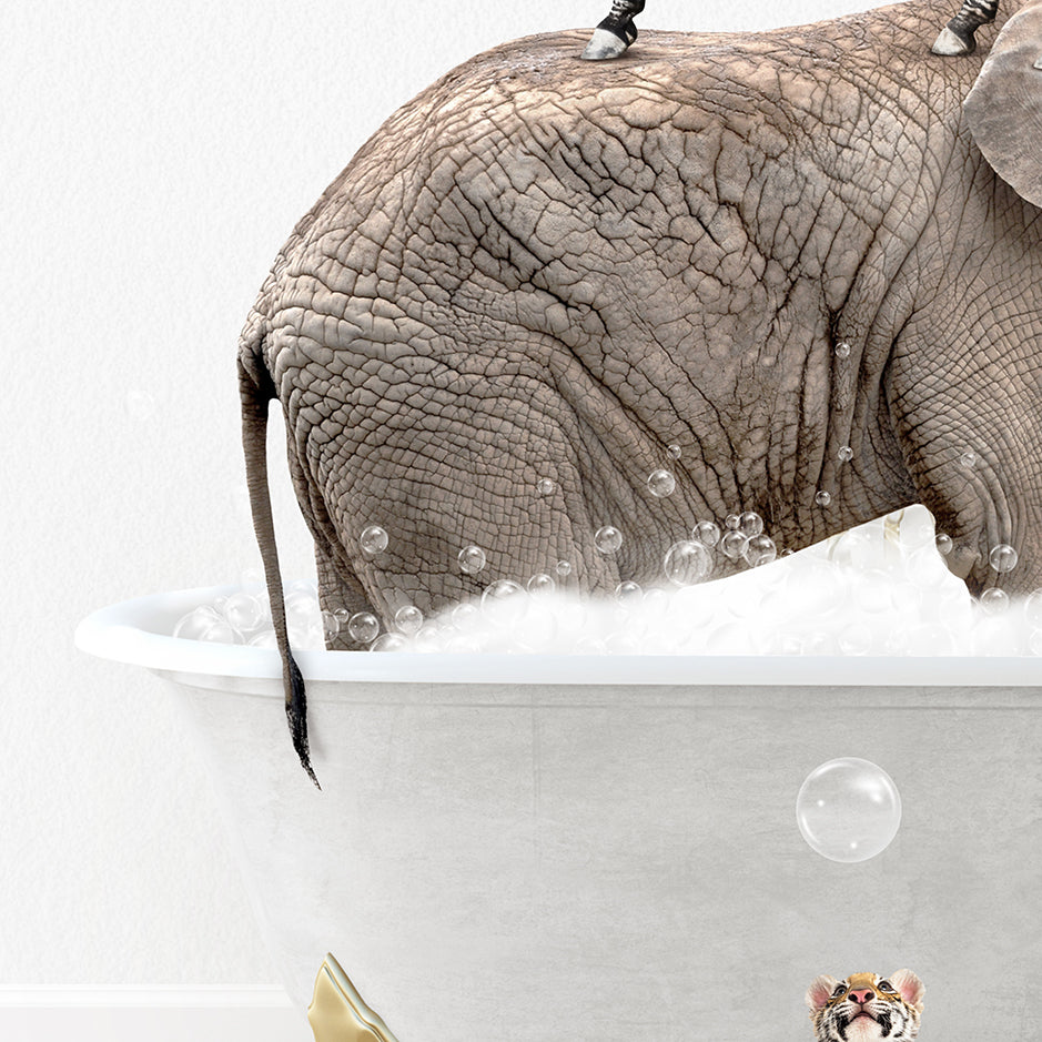 an elephant in a bath tub with bubbles