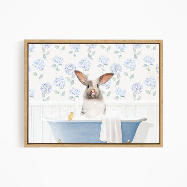 A white rabbit sitting in a blue bathtub, surrounded by blue flowers on the wall.