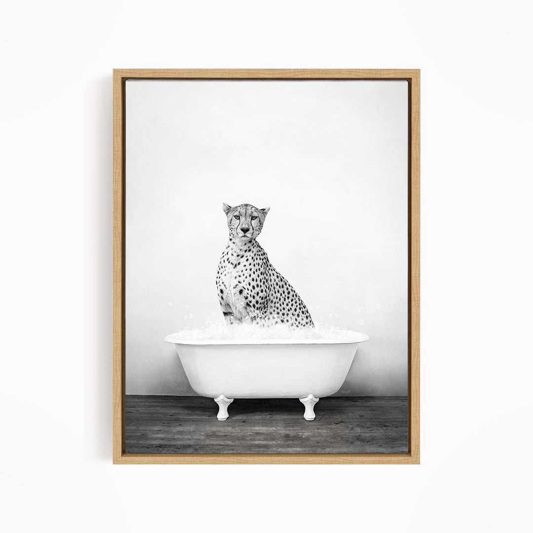 A cheetah sitting in a white bathtub filled with water.