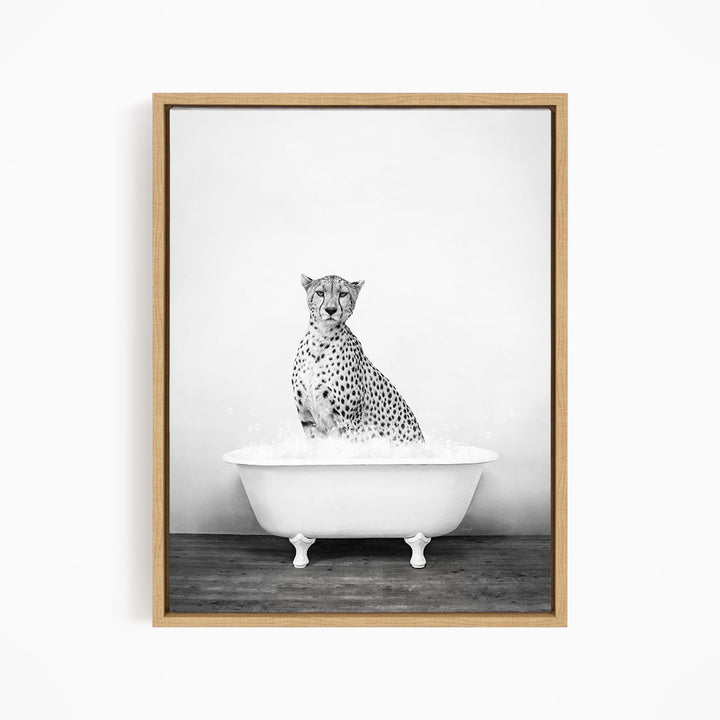 A cheetah sitting in a white bathtub filled with water.