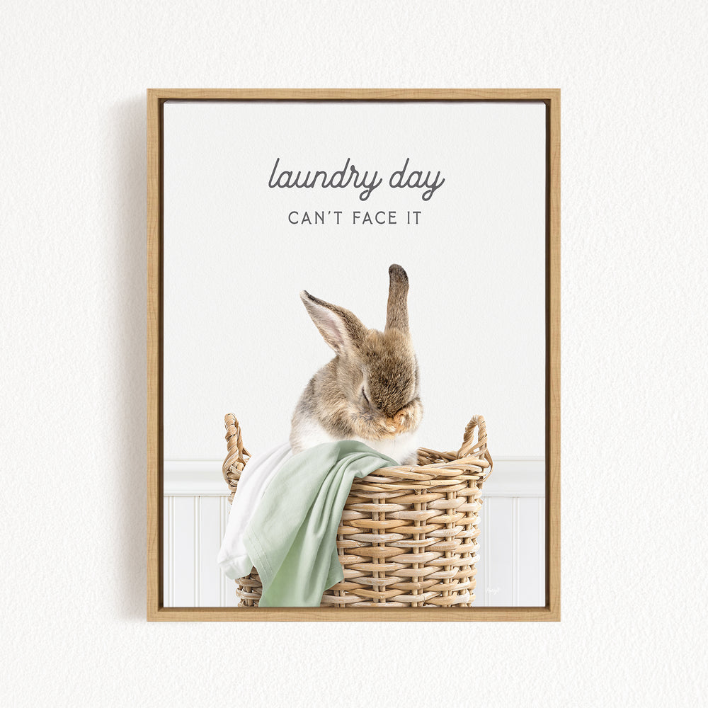 A cute rabbit sitting in a wicker basket, with the text "laundry day can't face it" written above it.