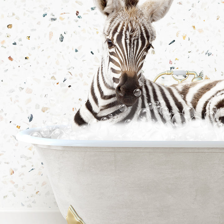 a baby zebra laying in a bath tub