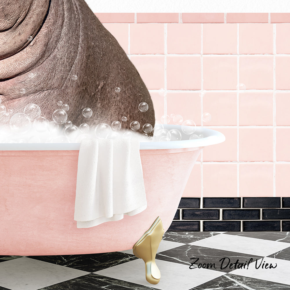 A pink bathtub filled with bubbles, with a towel hanging on the side and a gold bathtub faucet visible.