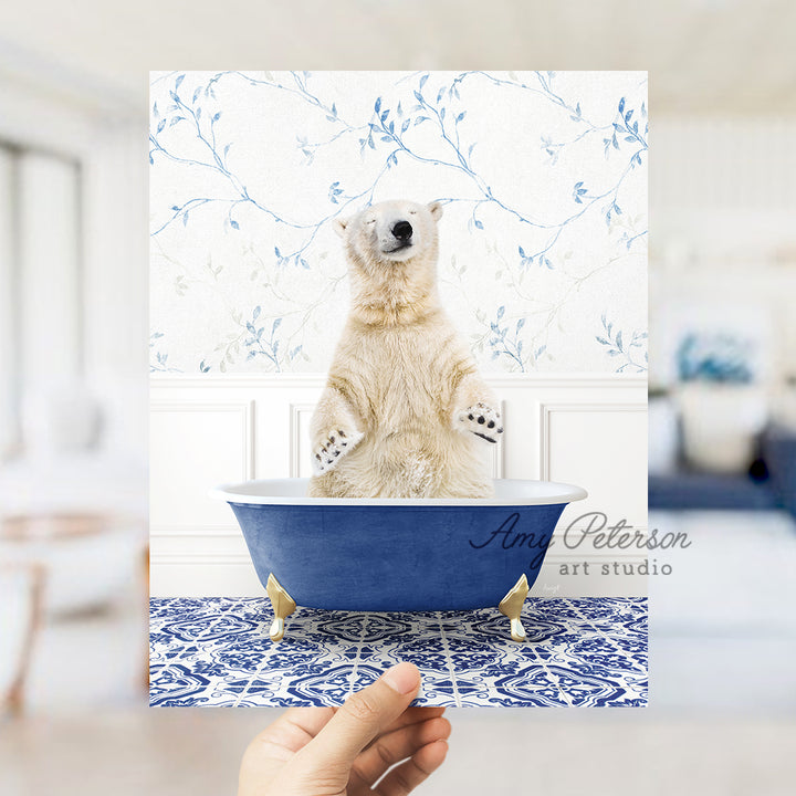 a polar bear sitting in a blue bath tub