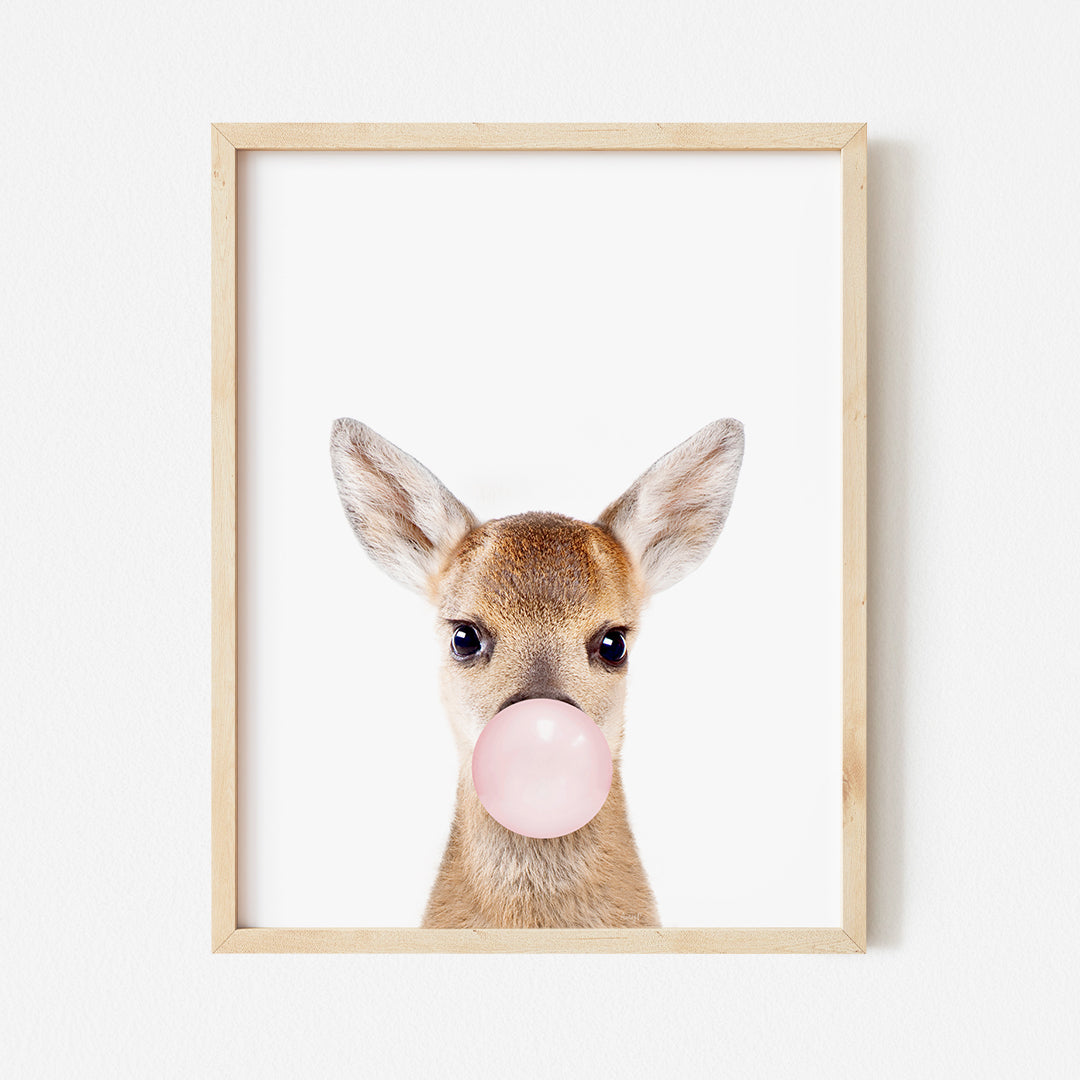 a picture of a deer with a bubble gum in its mouth