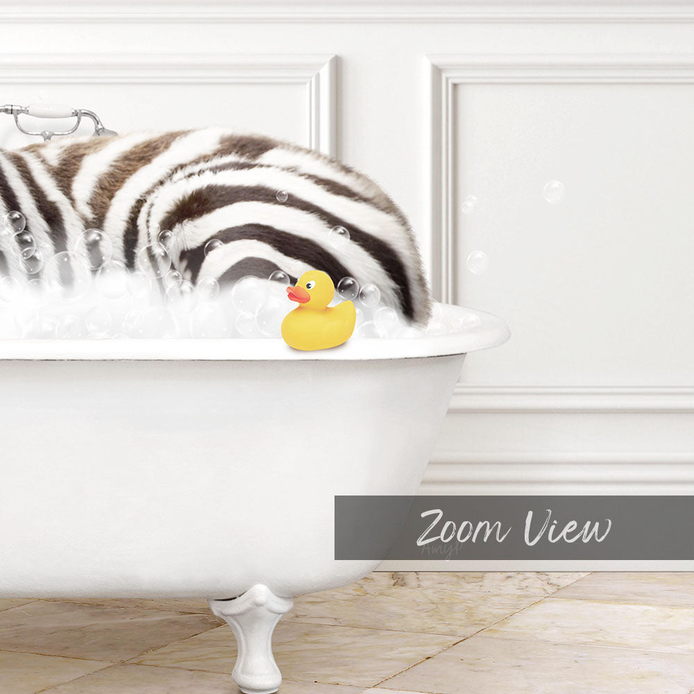 A white bathtub filled with bubbles, with a yellow rubber duck sitting in the water.