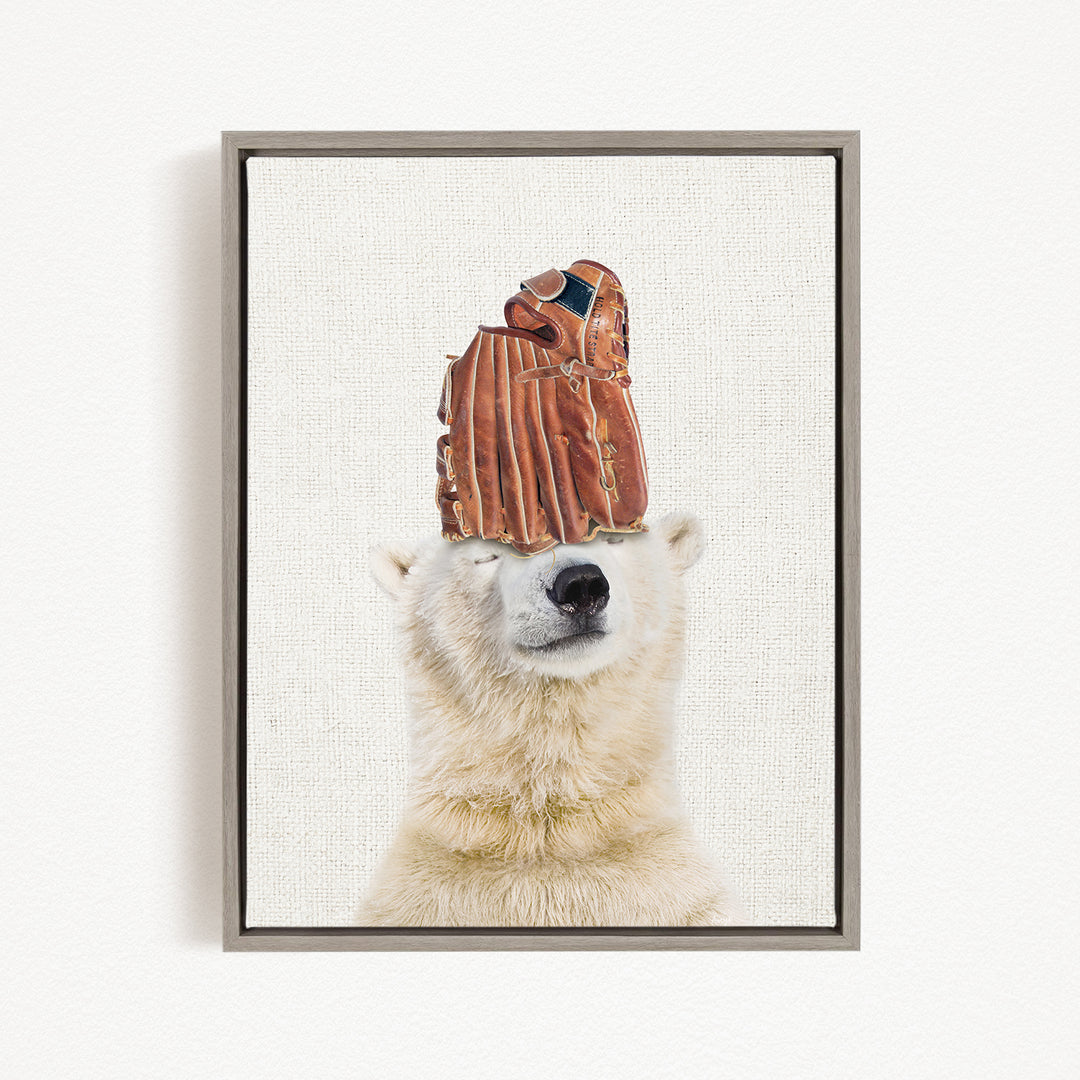 A polar bear wearing a baseball glove on its head, creating a humorous and playful scene.