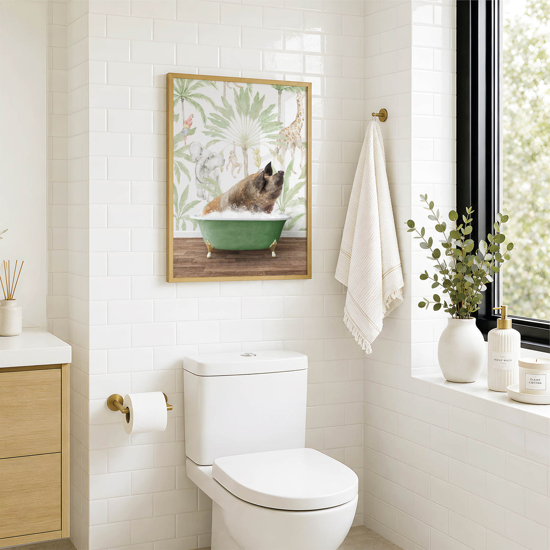 A bathroom with a white toilet, a framed picture of a pig in a bathtub, and a window with greenery on the sill.