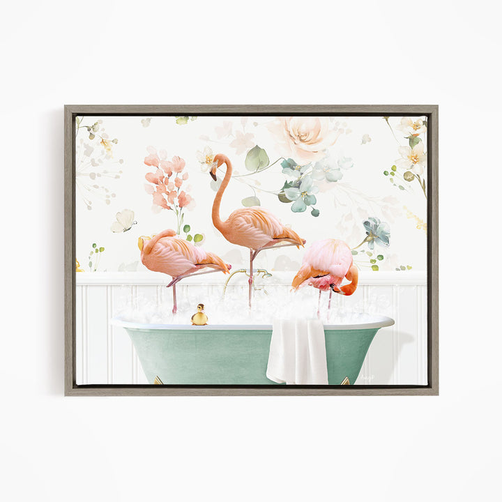 A framed print depicting three pink flamingos standing in a green bathtub filled with water, surrounded by a floral pattern.