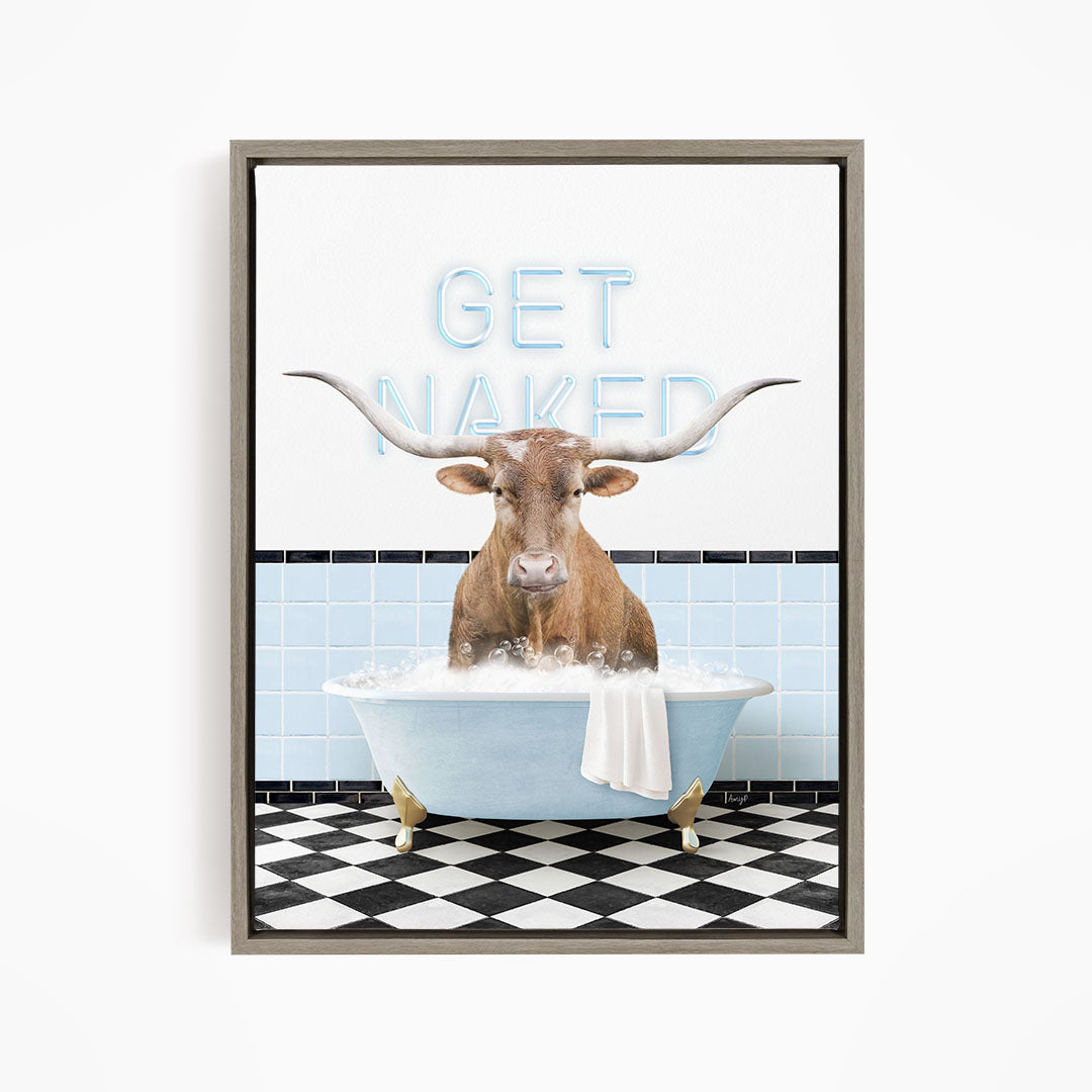 A framed image depicting a bull with large horns sitting in a bathtub, with the text "GET NAKED" displayed above it.