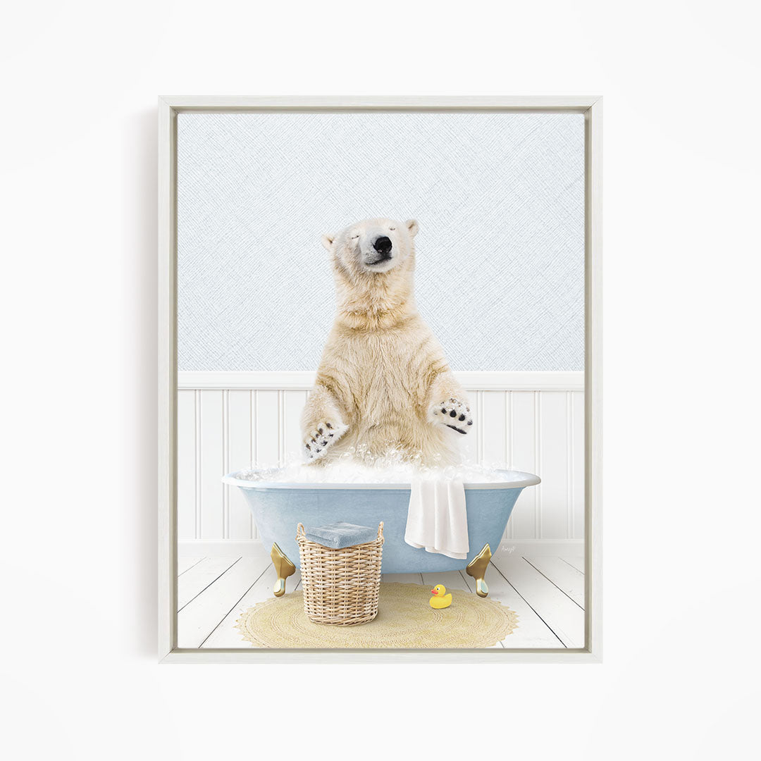 A polar bear is sitting in a bathtub filled with water, surrounded by a yellow rubber duck and a wicker basket.