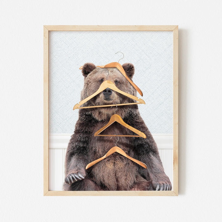 a picture of a bear with clothes hangers on it