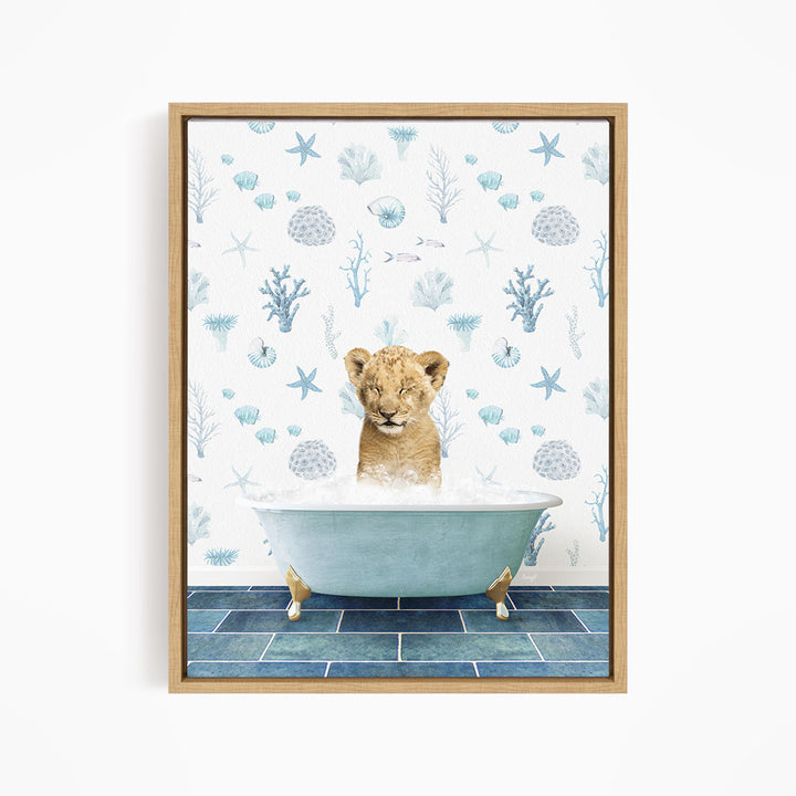 A young lion cub sitting in a blue bathtub filled with water, surrounded by a pattern of seashells, starfish, and other marine life.