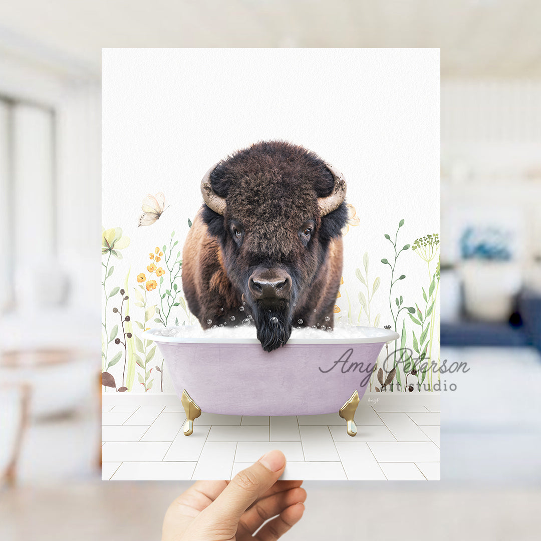 a person holding up a card with a picture of a bison in a bathtub