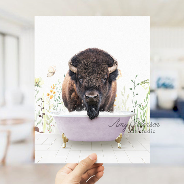 a person holding up a card with a picture of a bison in a bathtub