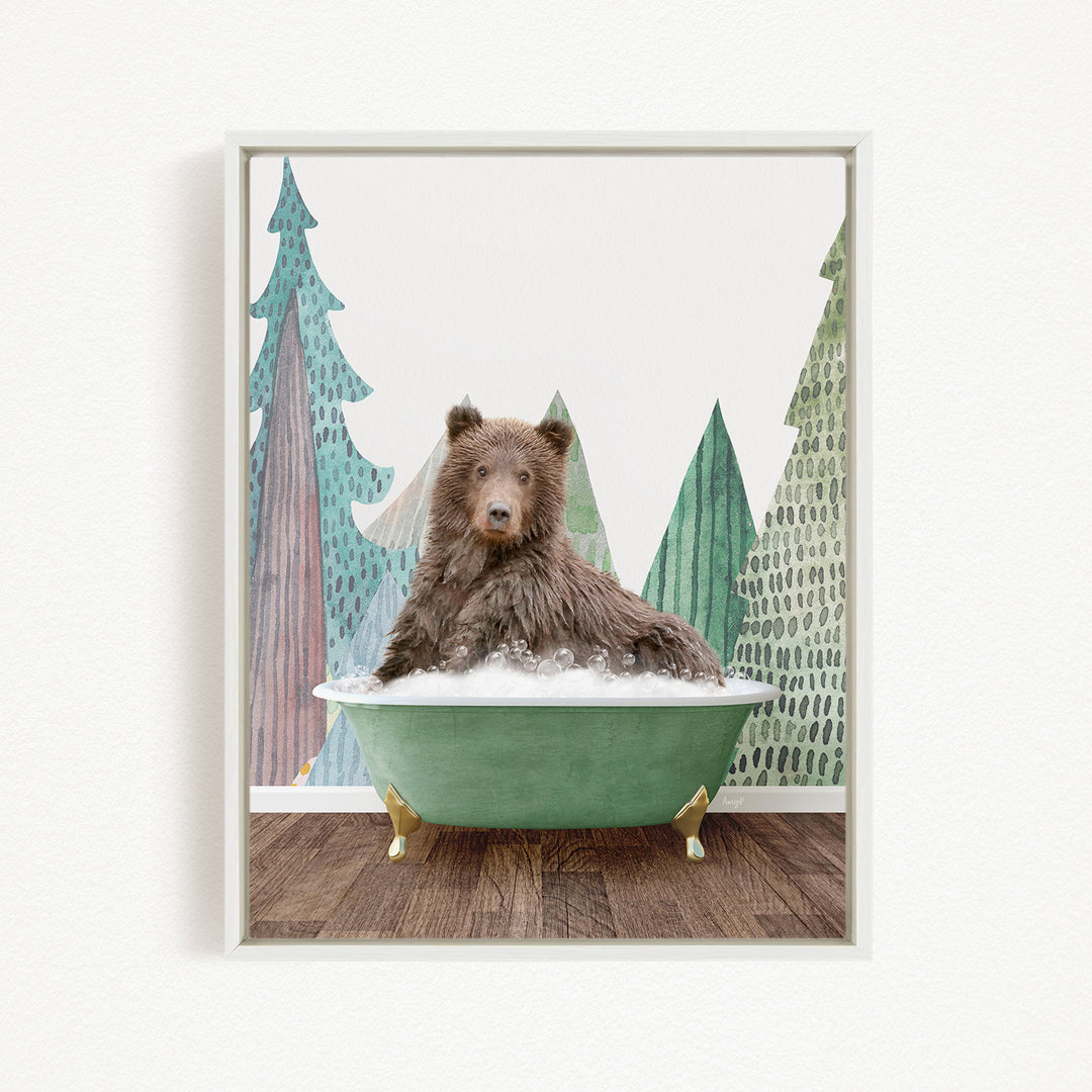 A brown bear is sitting in a green bathtub, surrounded by a forest scene with trees and a snowy landscape.