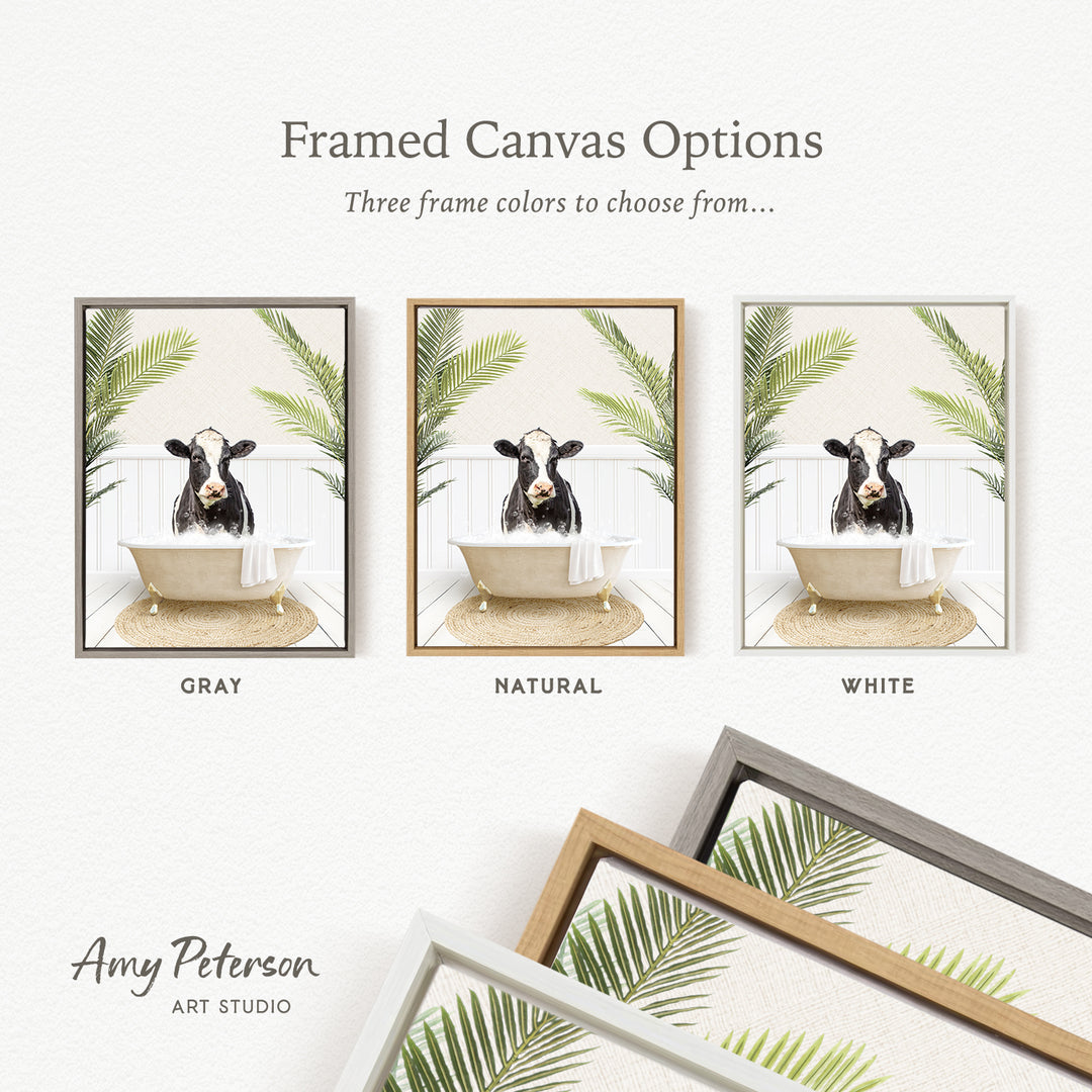 three framed canvas options featuring a cow in a bathtub, surrounded by tropical plants. The options include a gray, a natural, and a white frame.