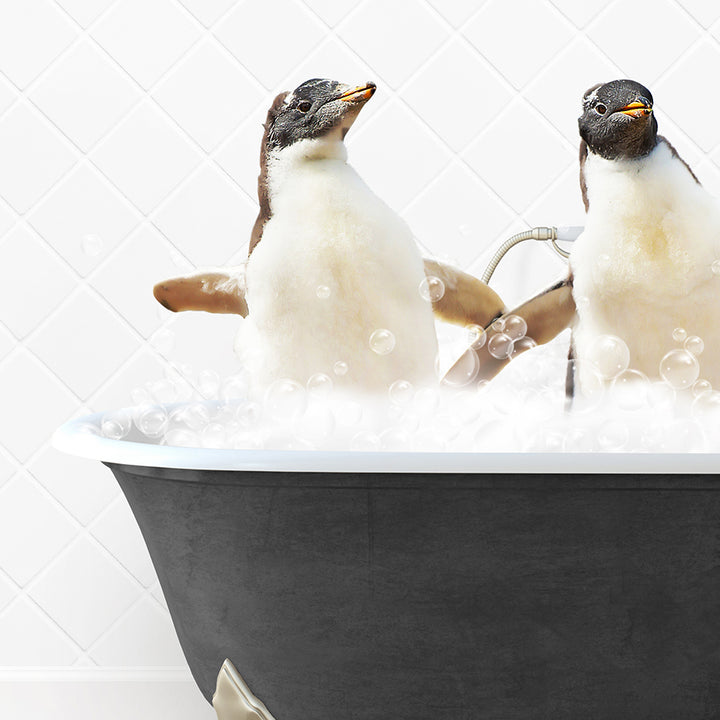 two penguins sitting in a bathtub with bubbles